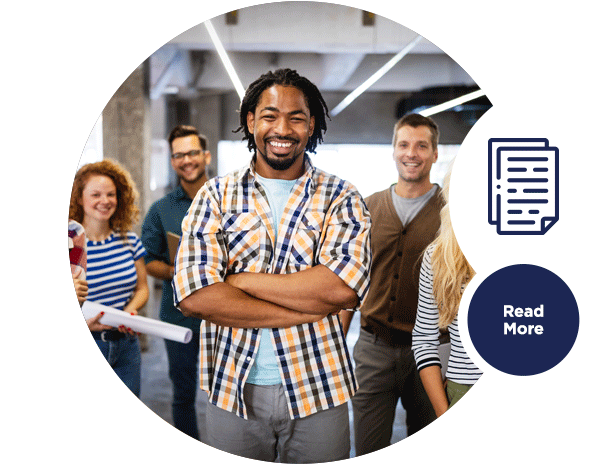 A group of smiling co-workers in an office.